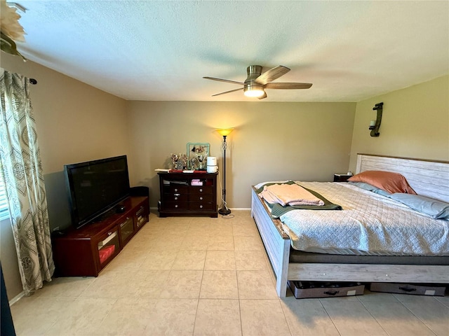 1886 Saint Andrews Pl Unit 1886, Longwood, FL 32779 - bedroom with a ceiling fan, light tile patterned floors, and a textured ceiling