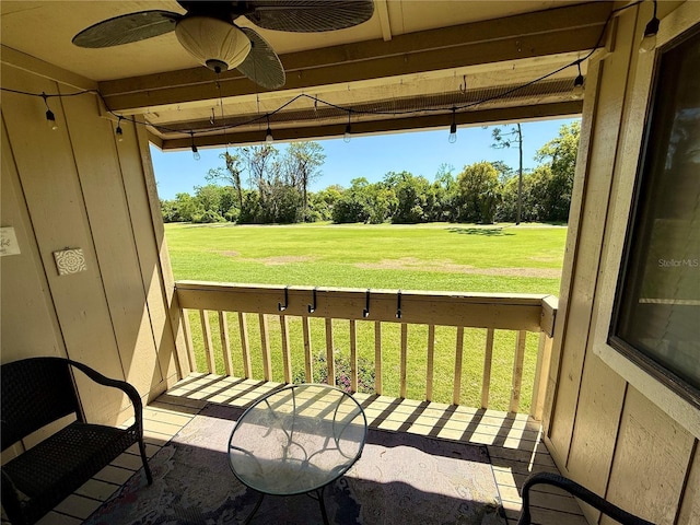 1886 Saint Andrews Pl Unit 1886, Longwood, FL 32779 - balcony featuring ceiling fan and view of scattered trees
