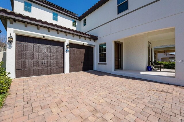 14645 Scott Key Dr, Winter Garden, FL 34787 - garage with decorative driveway