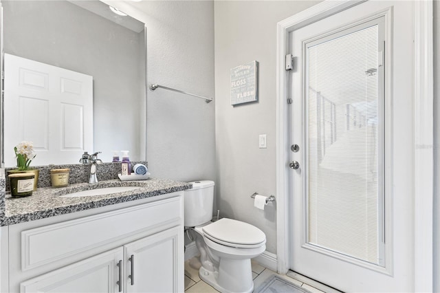 14645 Scott Key Dr, Winter Garden, FL 34787 - bathroom featuring vanity, toilet, and tile patterned flooring