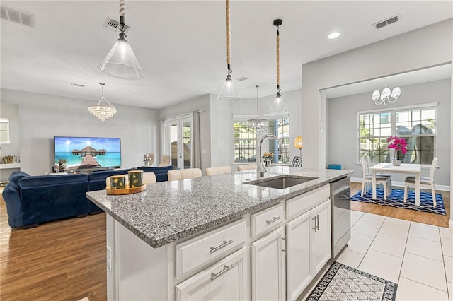 14645 Scott Key Dr, Winter Garden, FL 34787 - kitchen with a sink, visible vents, a notable chandelier, and dishwasher