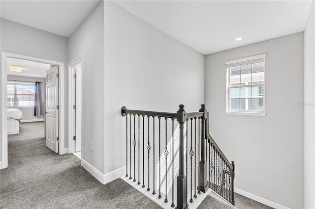14645 Scott Key Dr, Winter Garden, FL 34787 - corridor with baseboards, an upstairs landing, and carpet flooring