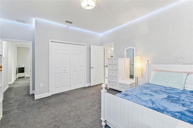 14645 Scott Key Dr, Winter Garden, FL 34787 - bedroom with a closet, visible vents, baseboards, and dark colored carpet