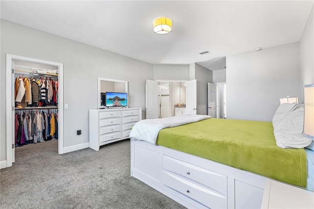 14645 Scott Key Dr, Winter Garden, FL 34787 - bedroom featuring visible vents, a walk in closet, a closet, carpet floors, and baseboards