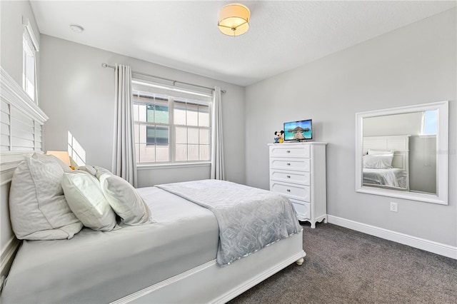 14645 Scott Key Dr, Winter Garden, FL 34787 - bedroom with baseboards and dark colored carpet