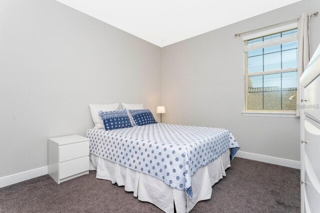 14645 Scott Key Dr, Winter Garden, FL 34787 - bedroom with dark carpet and baseboards
