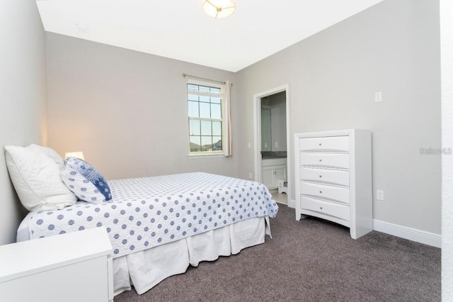 14645 Scott Key Dr, Winter Garden, FL 34787 - bedroom featuring baseboards, ensuite bathroom, and dark carpet