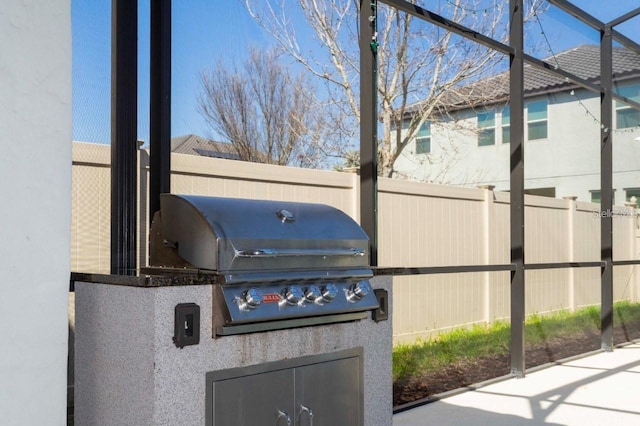 14645 Scott Key Dr, Winter Garden, FL 34787 - view of patio with an outdoor kitchen, fence, and a grill