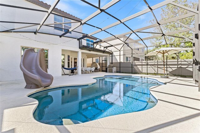 14645 Scott Key Dr, Winter Garden, FL 34787 - view of swimming pool with a patio, fence, a water slide, a fenced in pool, and a lanai