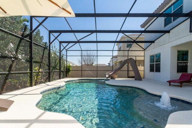 14645 Scott Key Dr, Winter Garden, FL 34787 - view of pool featuring fence, a water slide, a fenced in pool, a lanai, and a patio area