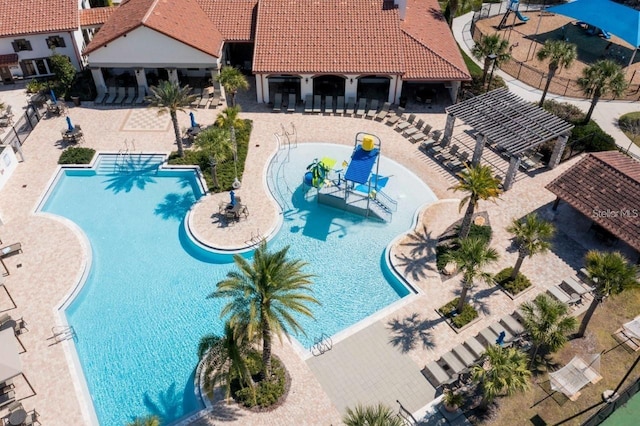 14645 Scott Key Dr, Winter Garden, FL 34787 - community pool with fence, a water play area, and a patio area