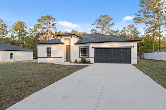 7550 N Gims Way, Citrus Springs, FL 34433 - prairie-style home featuring stucco siding, an attached garage, driveway, and a shingled roof