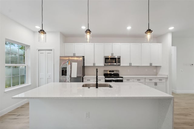 7550 N Gims Way, Citrus Springs, FL 34433 - kitchen featuring stainless steel appliances, baseboards, white cabinetry, and recessed lighting