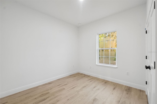 7550 N Gims Way, Citrus Springs, FL 34433 - empty room with light wood-type flooring and baseboards