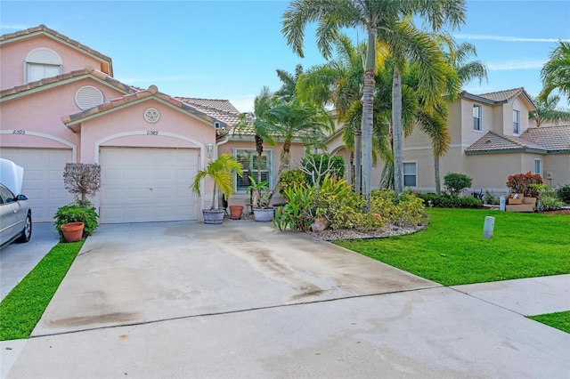10589 Pelican Dr, Wellington, FL 33414 - mediterranean / spanish-style home featuring a tiled roof, concrete driveway, a front yard, stucco siding, and a garage