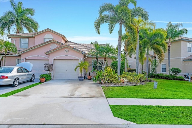 10589 Pelican Dr, Wellington, FL 33414 - mediterranean / spanish house with a tile roof, concrete driveway, a garage, and a front yard
