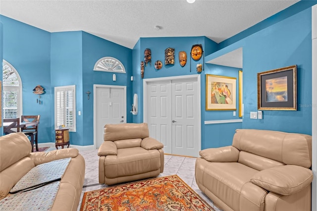 10589 Pelican Dr, Wellington, FL 33414 - tiled living room with baseboards and a textured ceiling