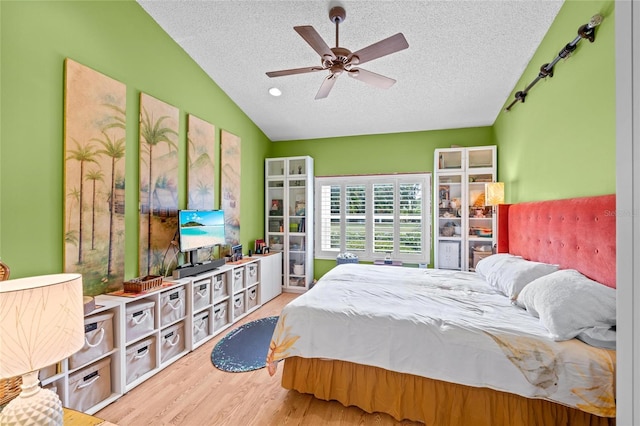 10589 Pelican Dr, Wellington, FL 33414 - bedroom with a textured ceiling, a ceiling fan, lofted ceiling, and wood finished floors