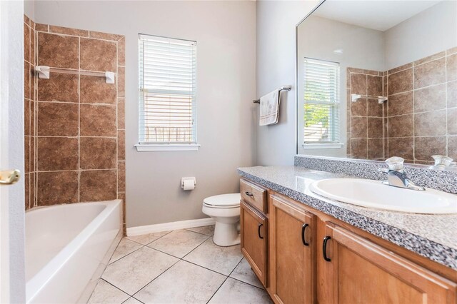 2361 Baker Ave, Orlando, FL 32833 - bathroom with toilet, tile patterned flooring, baseboards, bathing tub / shower combination, and vanity