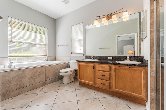 2361 Baker Ave, Orlando, FL 32833 - bathroom featuring tile patterned flooring, a garden tub, double vanity, and a sink