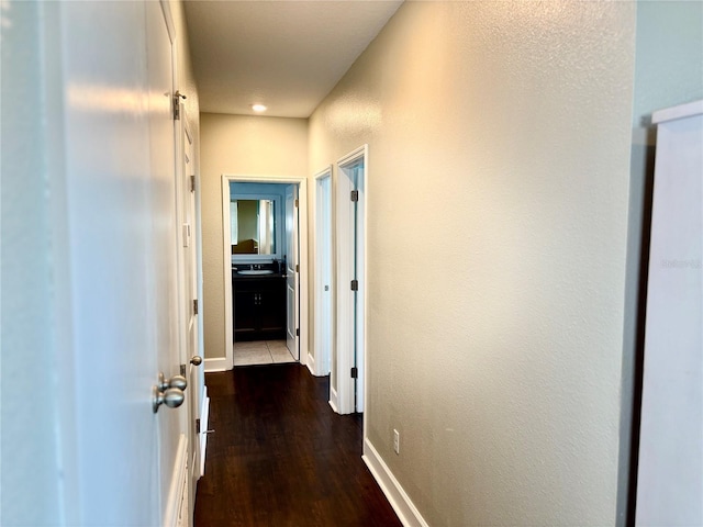 1337 Ash Tree Cv, Casselberry, FL 32707 - hallway featuring a textured wall, baseboards, and wood finished floors