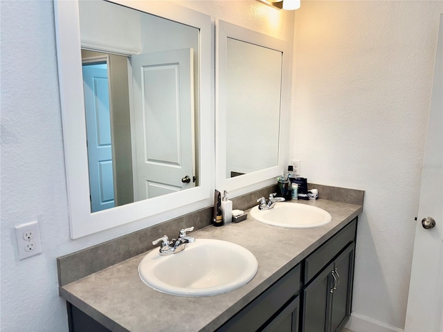 1337 Ash Tree Cv, Casselberry, FL 32707 - bathroom with double vanity, a sink, and a textured wall