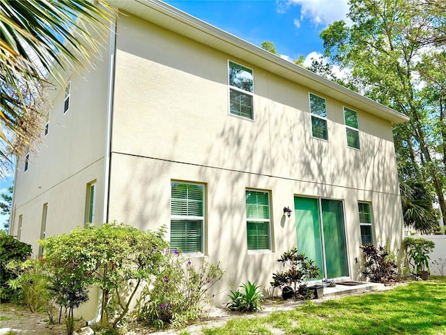 1337 Ash Tree Cv, Casselberry, FL 32707 - rear view of house with stucco siding
