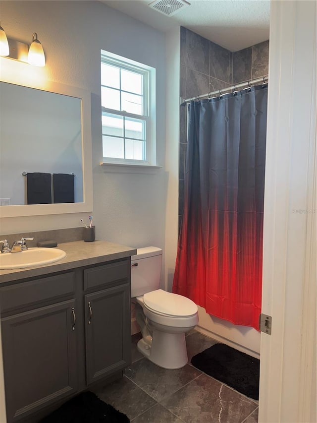 1337 Ash Tree Cv, Casselberry, FL 32707 - full bathroom featuring toilet, vanity, and visible vents