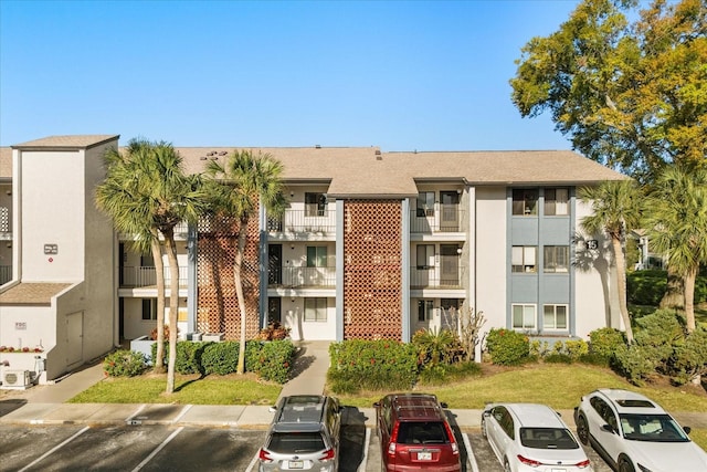 view of property with uncovered parking
