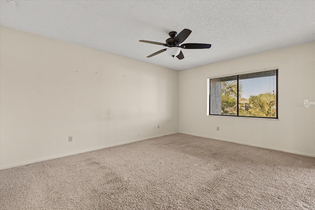 unfurnished room featuring a ceiling fan, baseboards, carpet floors, and a textured ceiling