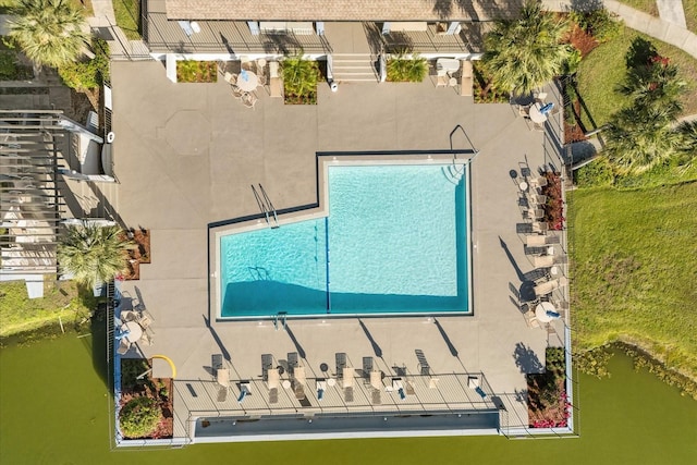 birds eye view of property with a water view