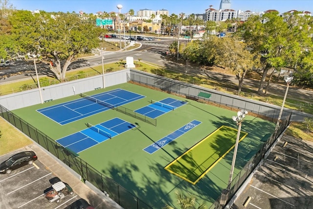 view of tennis court with fence