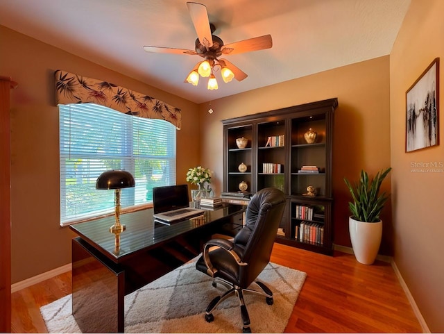 2519 Cypress Trace Cir, Orlando, FL 32825 - office with a ceiling fan, baseboards, and wood finished floors