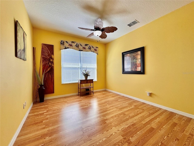 2519 Cypress Trace Cir, Orlando, FL 32825 - spare room featuring light wood finished floors, a textured ceiling, and ceiling fan
