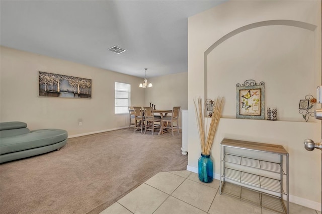5910 Windsong Oak Dr, Leesburg, FL 34748 - living room featuring baseboards, visible vents, light tile patterned flooring, light carpet, and a chandelier