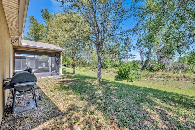 5910 Windsong Oak Dr, Leesburg, FL 34748 - view of yard featuring a sunroom