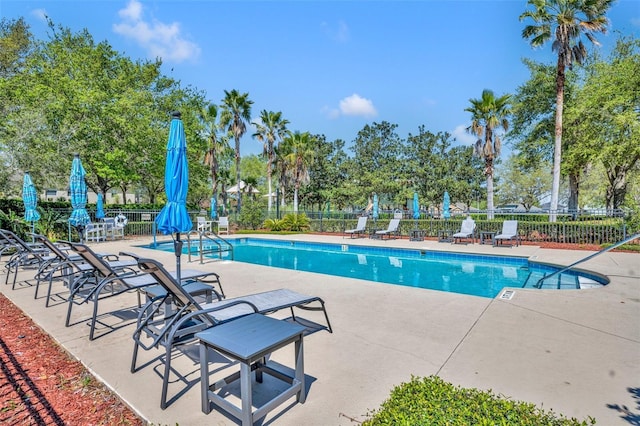 5910 Windsong Oak Dr, Leesburg, FL 34748 - community pool with a patio area and fence