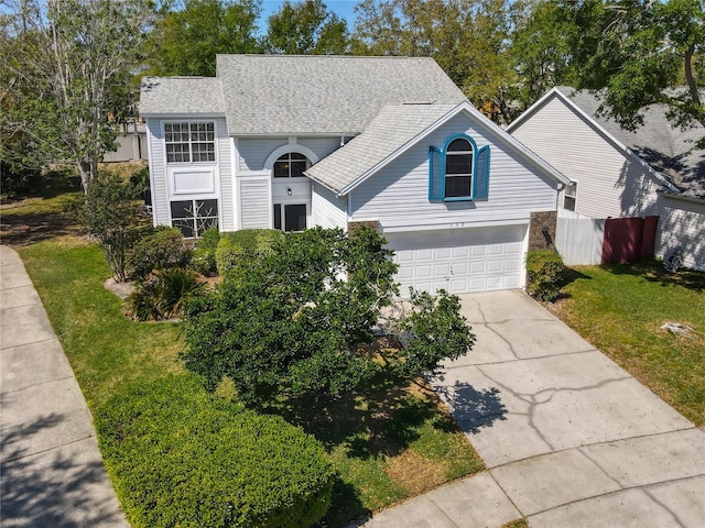 358 Morning Creek Cir, Apopka, FL 32712 - traditional home with a garage, a front yard, roof with shingles, and driveway