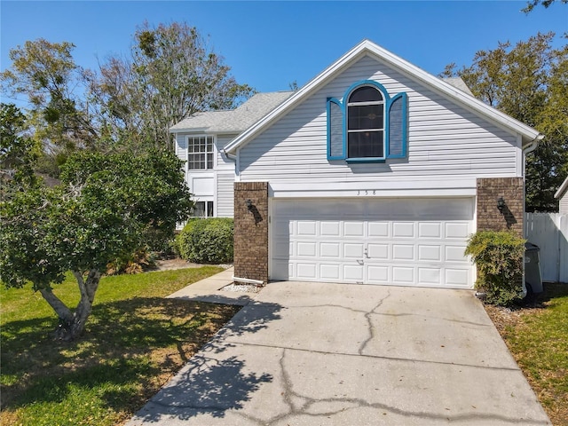 358 Morning Creek Cir, Apopka, FL 32712 - traditional home with concrete driveway, brick siding, a garage, and a front yard