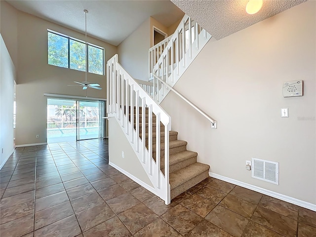358 Morning Creek Cir, Apopka, FL 32712 - stairs with a textured ceiling, a ceiling fan, visible vents, and baseboards