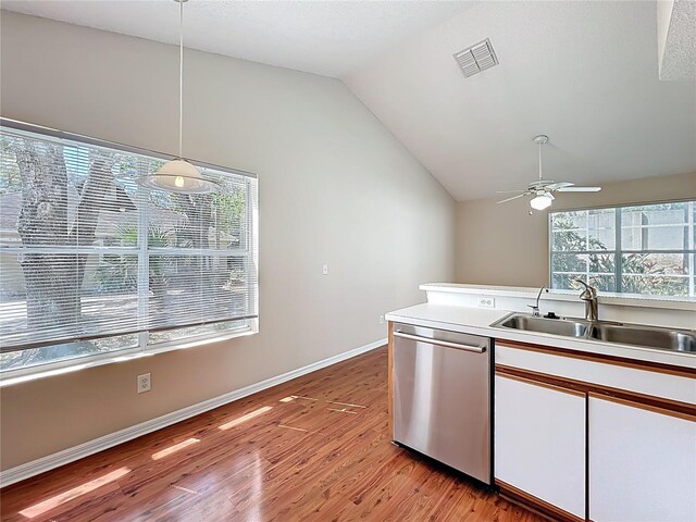 358 Morning Creek Cir, Apopka, FL 32712 - kitchen with light wood finished floors, ceiling fan, vaulted ceiling, stainless steel dishwasher, and a sink