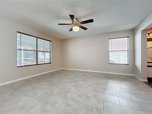 358 Morning Creek Cir, Apopka, FL 32712 - unfurnished room with baseboards, a textured ceiling, and a ceiling fan
