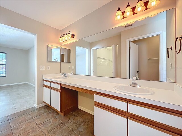 358 Morning Creek Cir, Apopka, FL 32712 - full bathroom with double vanity, baseboards, visible vents, and a sink