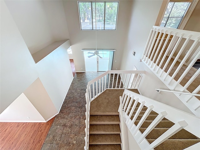 358 Morning Creek Cir, Apopka, FL 32712 - stairs featuring stone finish flooring, a high ceiling, a healthy amount of sunlight, and ceiling fan