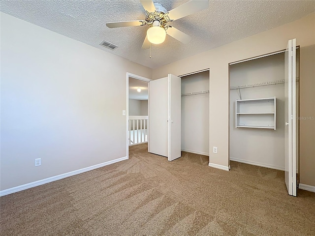 358 Morning Creek Cir, Apopka, FL 32712 - unfurnished bedroom featuring carpet flooring, baseboards, visible vents, and multiple closets