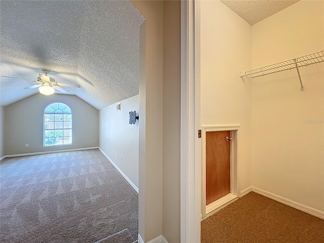 358 Morning Creek Cir, Apopka, FL 32712 - bonus room with baseboards, lofted ceiling, carpet flooring, a textured ceiling, and a ceiling fan