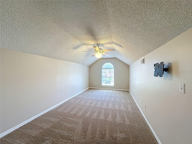 358 Morning Creek Cir, Apopka, FL 32712 - additional living space featuring visible vents, a textured ceiling, lofted ceiling, light colored carpet, and ceiling fan