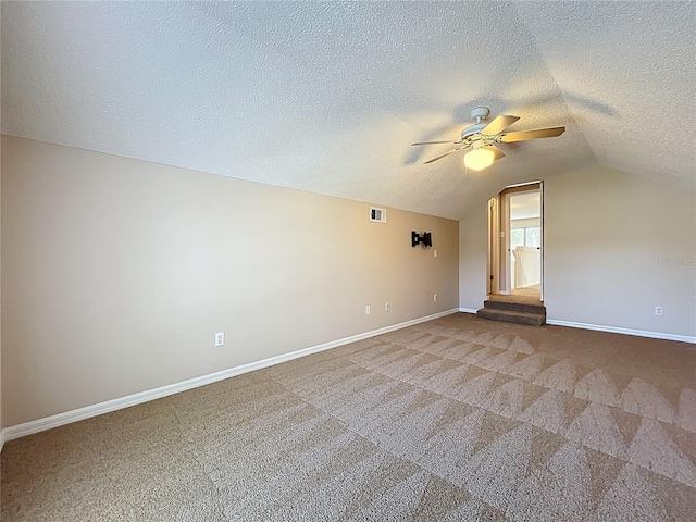 358 Morning Creek Cir, Apopka, FL 32712 - carpeted spare room featuring a ceiling fan, visible vents, baseboards, lofted ceiling, and a textured ceiling