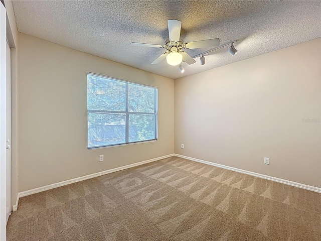 358 Morning Creek Cir, Apopka, FL 32712 - unfurnished room featuring rail lighting, light colored carpet, and a textured ceiling