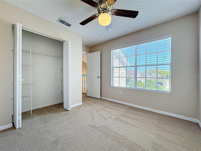 358 Morning Creek Cir, Apopka, FL 32712 - unfurnished bedroom featuring visible vents, a textured ceiling, a closet, carpet floors, and baseboards